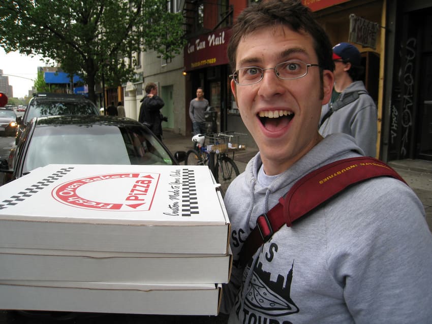 scott wiener pizza tour guide holding boxes of pizza