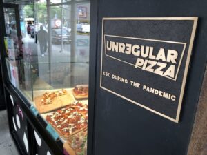 sign for Unregular Pizza