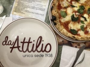 an empty place next to a pizza margherita in Naples Italy