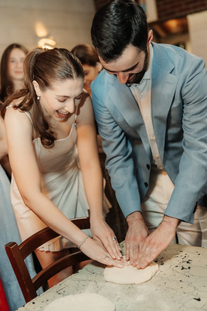 pizza tour wedding couple touching dough